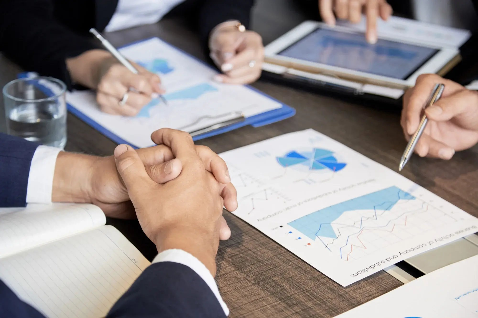crop-colleagues-with-papers-tablet